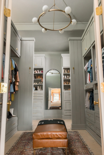 Closet, design, chandelier, ottoman, primary closet, arched mirror, paneled walls, master closet